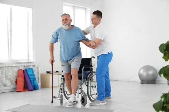 Physiotherapist assessing a patient's shoulder range of movement